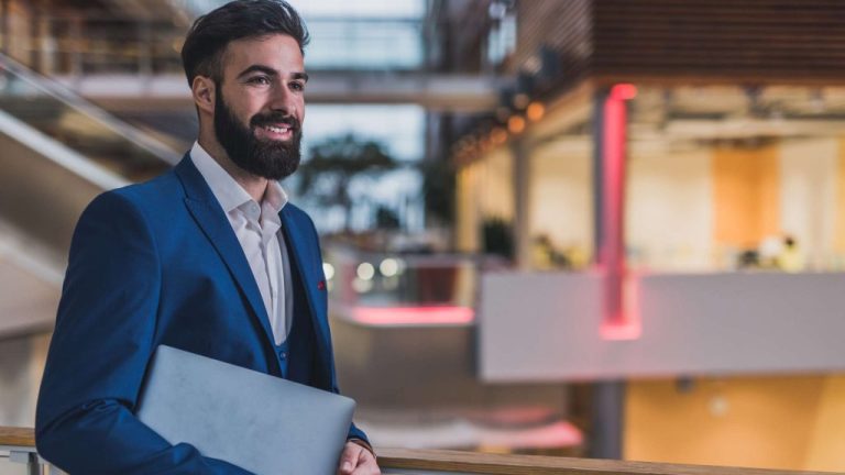 Professional businessman walks to a waiting chauffeur standing by luxury vehicle in Barcelona, ready for a corporate transfer